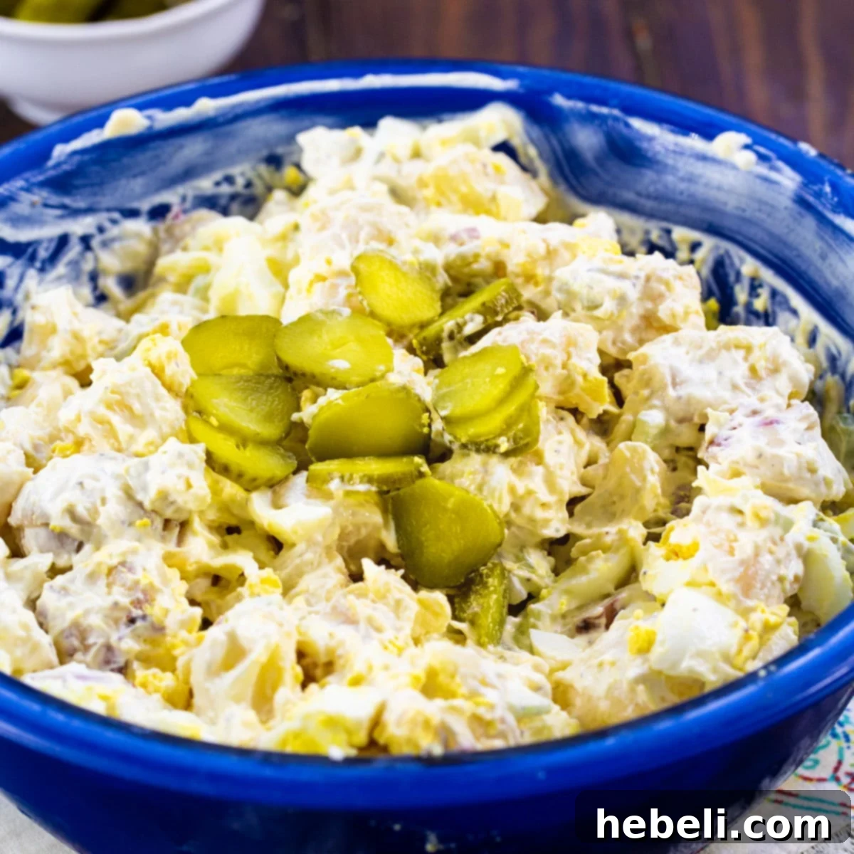 Dill Pickle Potato Salad in a blue bowl.
