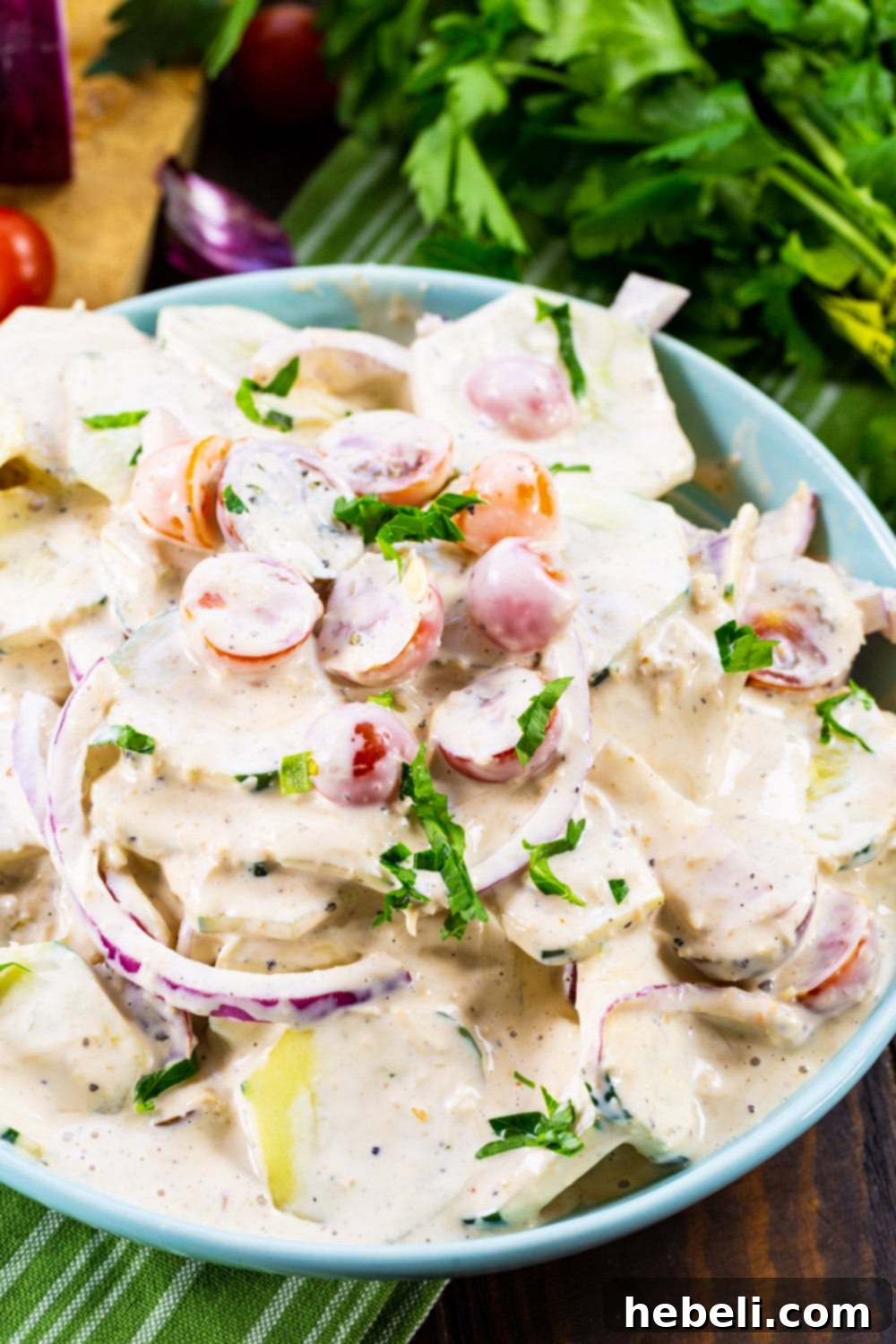 Tuscan Creamed Cucumber Salad 3 Creamy Cucumbers in a serving bowl.