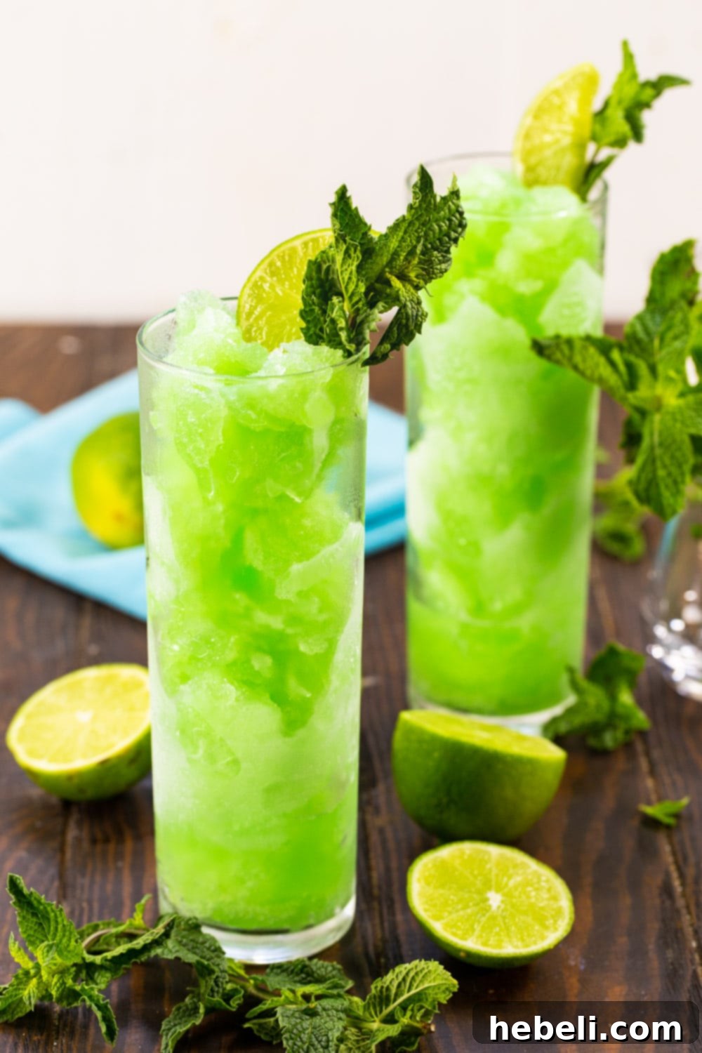 Two Mojito Slushies in tall glasses.