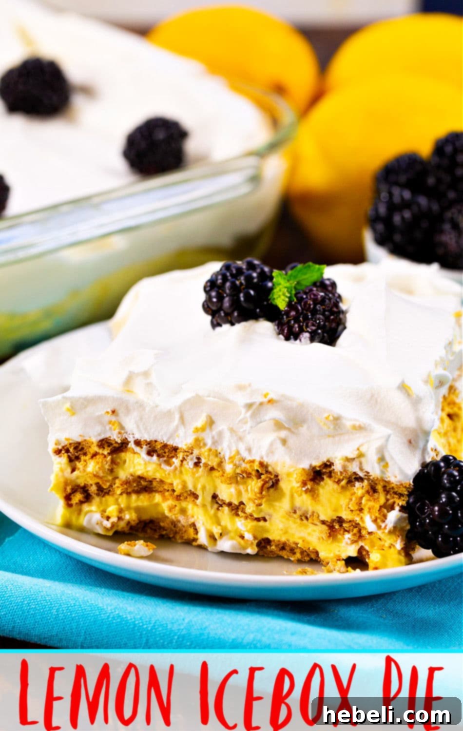 Zesty Lemon Icebox Cake 5 A top-down view of the whole Lemon Icebox Cake in a baking dish, beautifully garnished with fresh berries and lemon slices.
