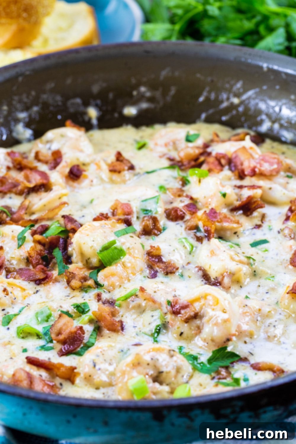 Velvety Garlic Parmesan Shrimp 3 Garlic Shrimp sizzling in a nonstick pan, developing a beautiful pink color.