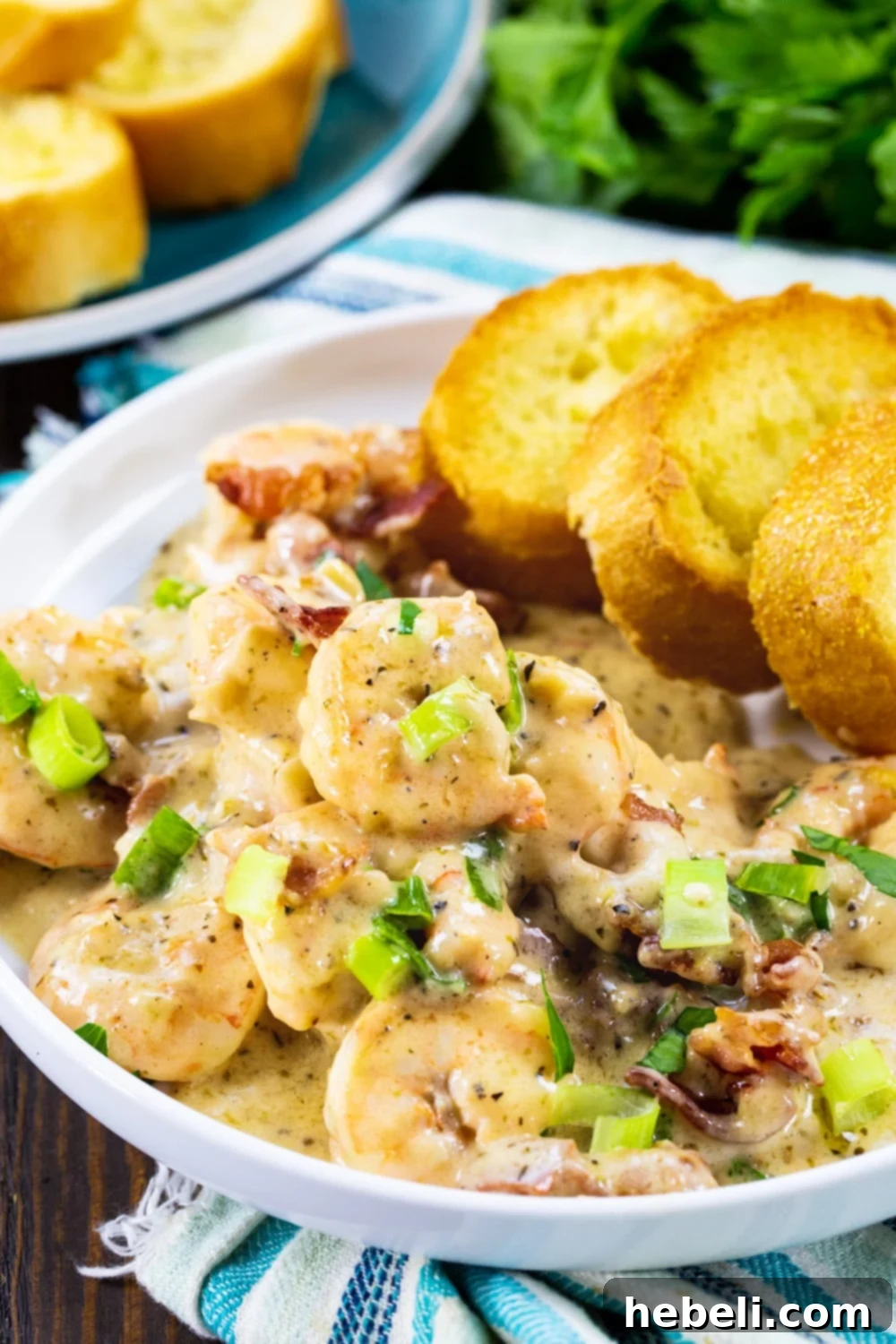Velvety Garlic Parmesan Shrimp 4 Close-up of Garlic Shrimp in Creamy Parmesan Sauce served on a plate, garnished with fresh parsley.