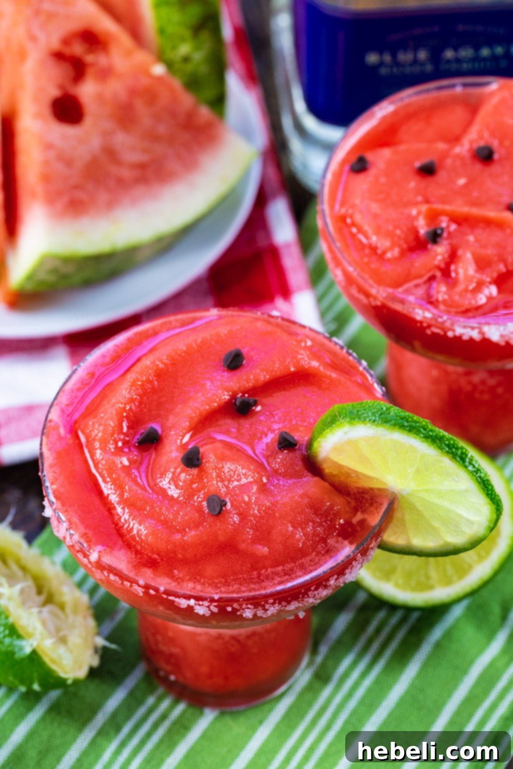 Icy Watermelon Margarita Bliss 4 A close-up of a single Frozen Watermelon Margarita, beautifully garnished with mini chocolate chips, resembling watermelon seeds.