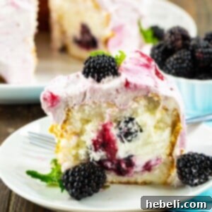 Slice of Blackberries and Cream Angel Food Cake on a plate.