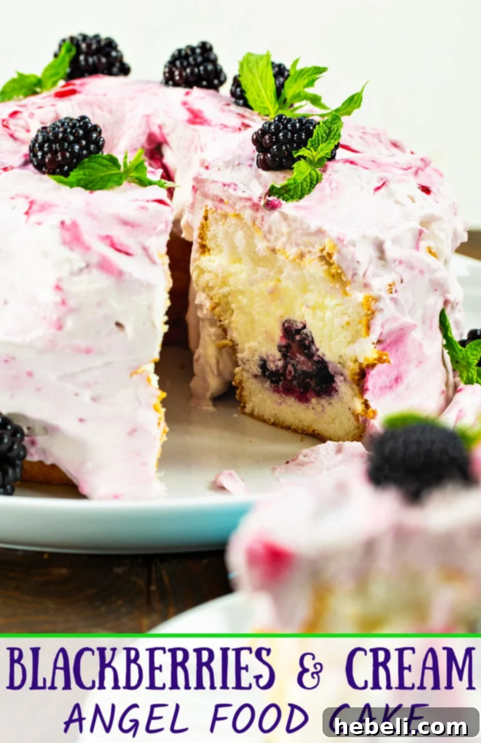 A stunning overhead view of the finished Blackberries and Cream Angel Food Cake, garnished with fresh berries and mint.