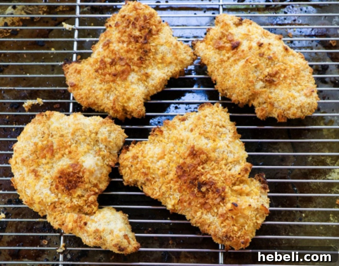 Baked chicken pieces on a wire rack