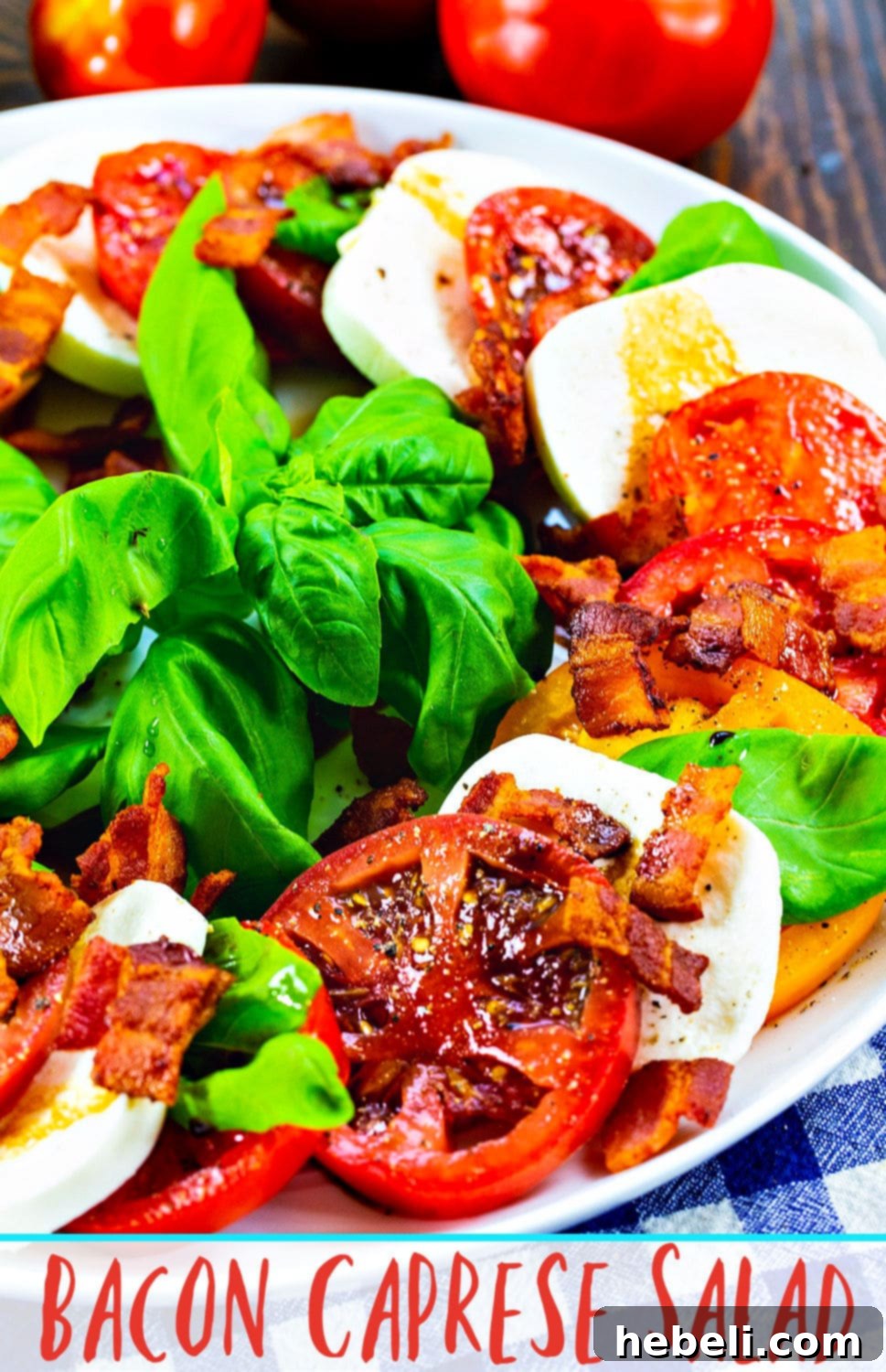 A visually stunning close-up of Bacon Caprese Salad, emphasizing the vibrant colors and textures of the ingredients, perfect for a summer gathering.