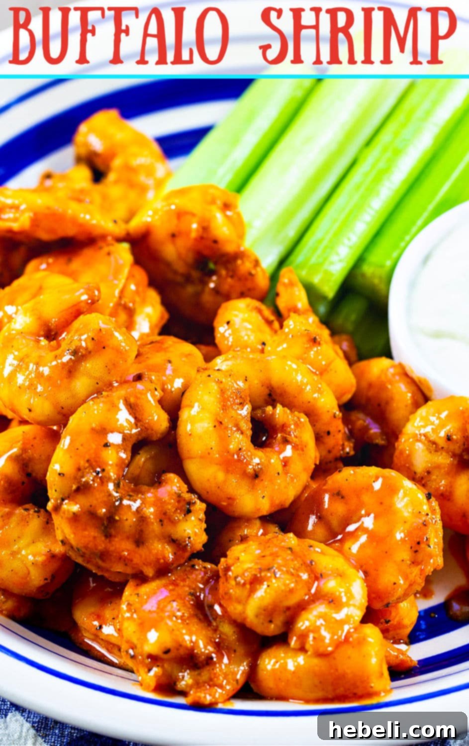 Close-up of broiled Buffalo Shrimp, glistening with buttery sauce, showcasing the seasoning and tender texture.