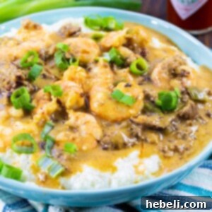 A delicious bowl of Sausage Gravy Shrimp and Grits, prepared and ready to serve.