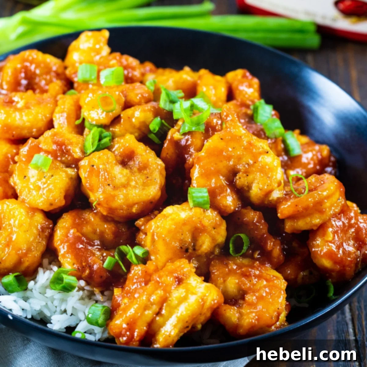 Flavorful Gochujang Shrimp served over fluffy white rice, ready to eat.