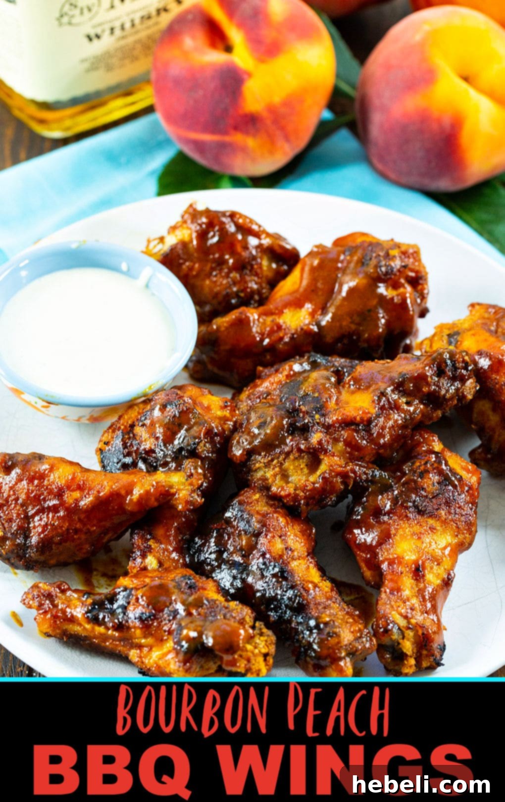 A close-up shot of Bourbon Peach BBQ Wings, perfectly glazed and ready to be served, showcasing the rich sauce.
