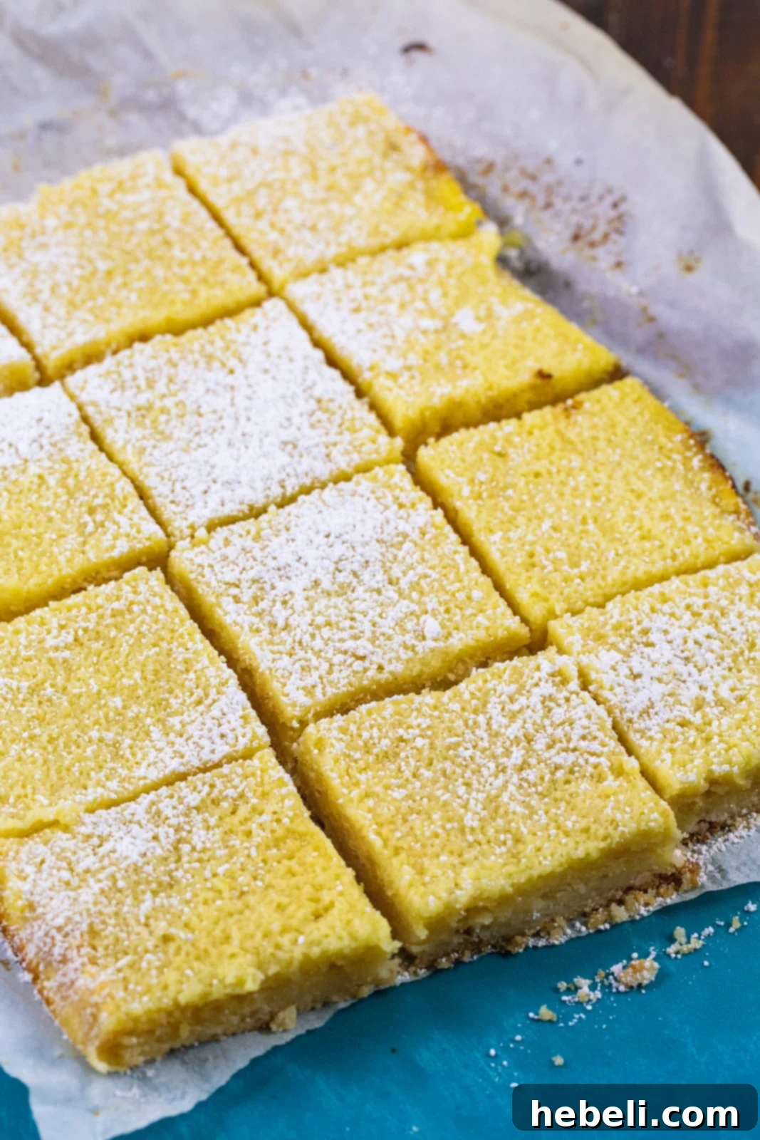 Chess Bars cut into squares on parchment paper.