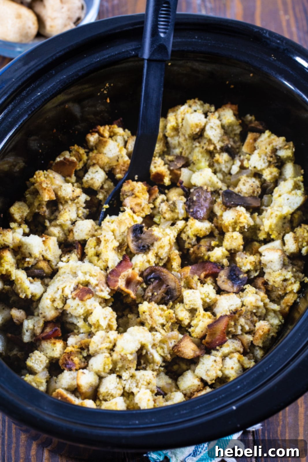 Savory Slow Cooker Bacon Mushroom Dressing 3 Bacon Mushroom Dressing mixture in a slow cooker, ready for cooking.