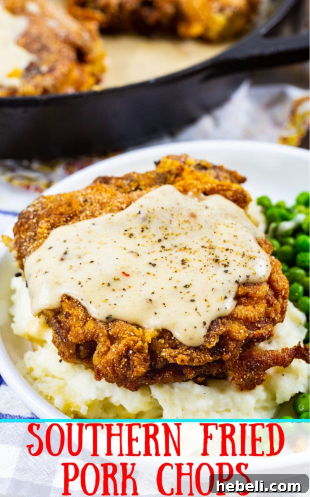 Close-up of a Southern Fried Pork Chop with White Gravy, emphasizing its golden crust and creamy texture.