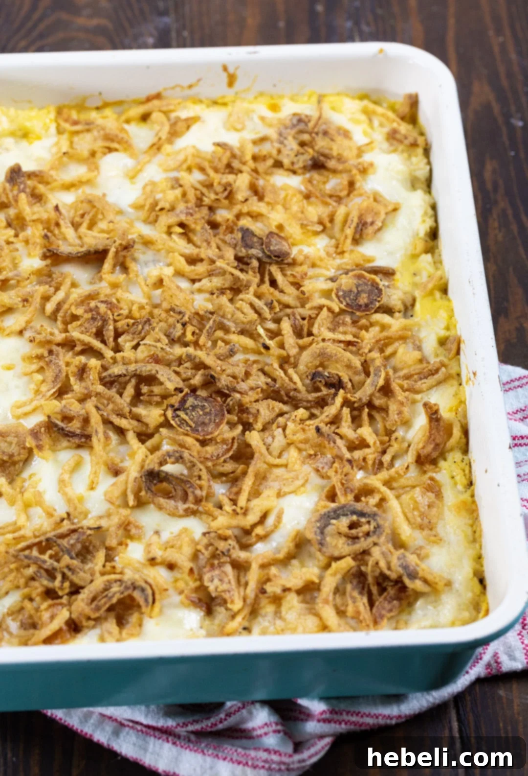 A golden-brown French Onion Chicken and Rice Casserole freshly baked in a 9x13 inch baking dish, ready to be served.
