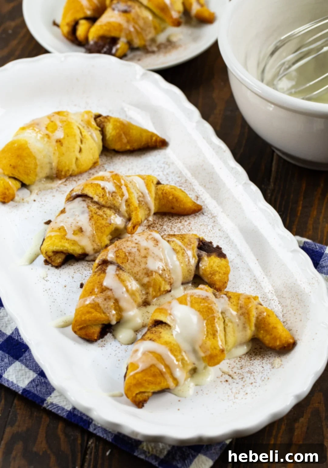 Cinnamon Roll Crescents on a Serving Tray Freshly baked Cinnamon Roll Crescents arranged beautifully on a serving tray, ready to be picked up.