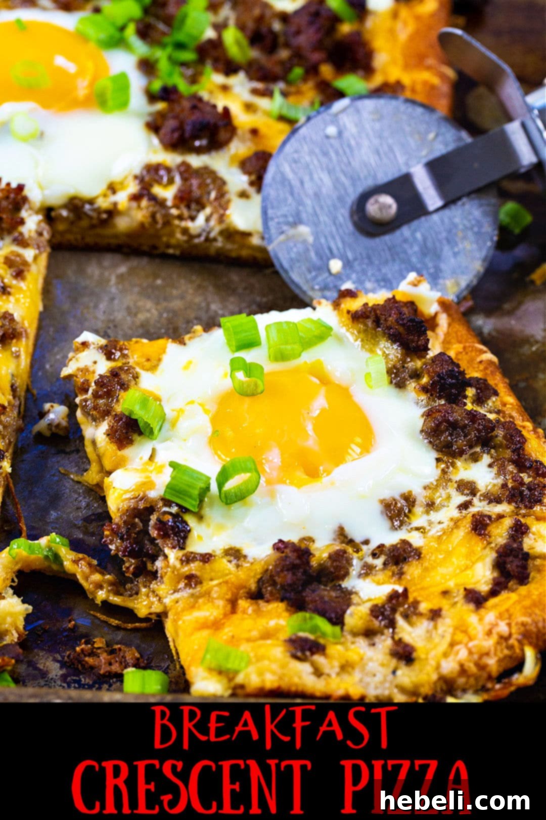 Breakfast Pizza with a slice cut.
