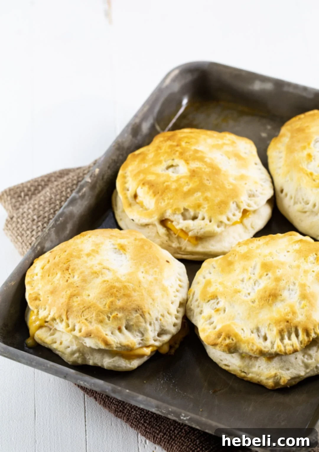 Baked Tuna Melts arranged on a baking sheet.