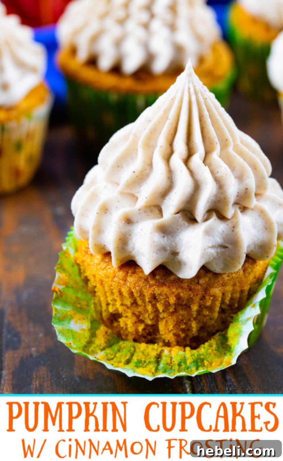 Pumpkin Cupcake with its liner partially peeled down, ready to be enjoyed.