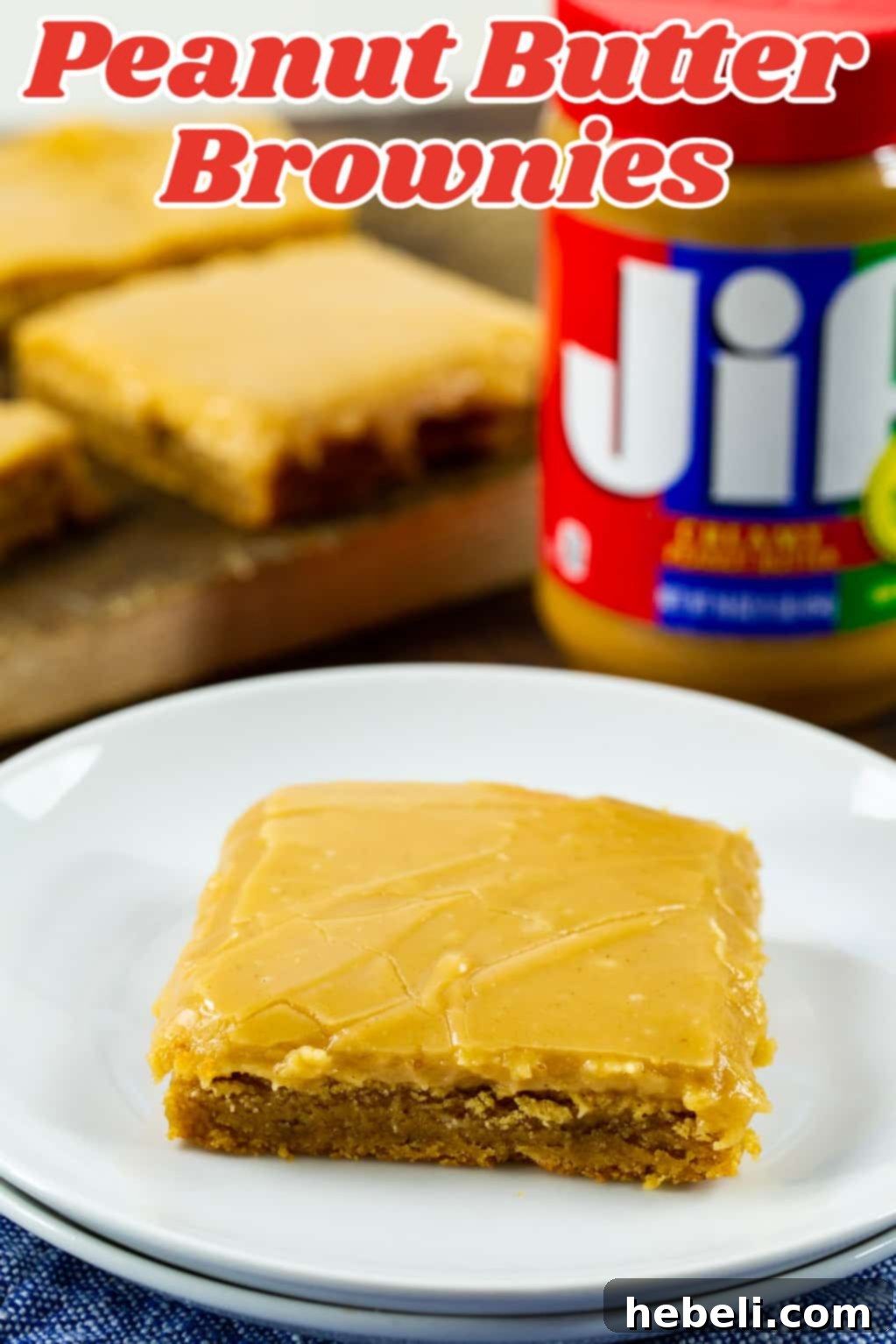Decadent Peanut Butter Brownies 4 A close-up shot of a single Peanut Butter Brownie with its smooth icing, on a delicate small plate.
