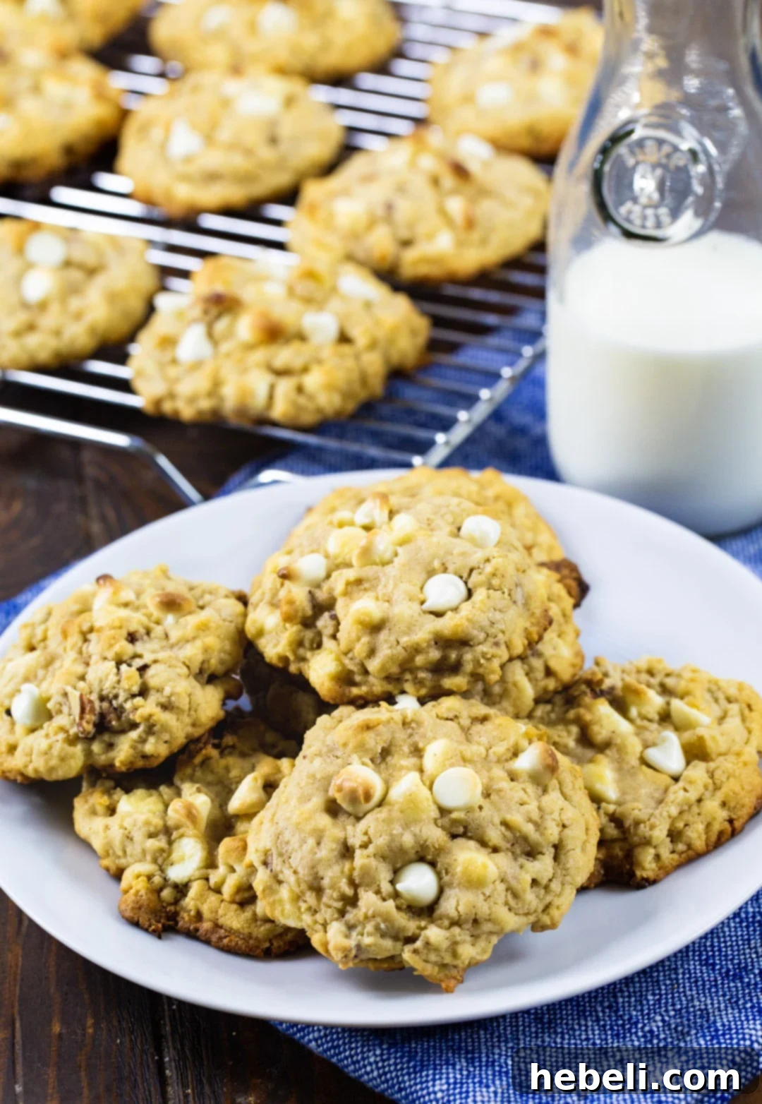 Pile of White Chocolate Oatmeal Cookies A generous pile of freshly baked White Chocolate Oatmeal Cookies, ready to be enjoyed.