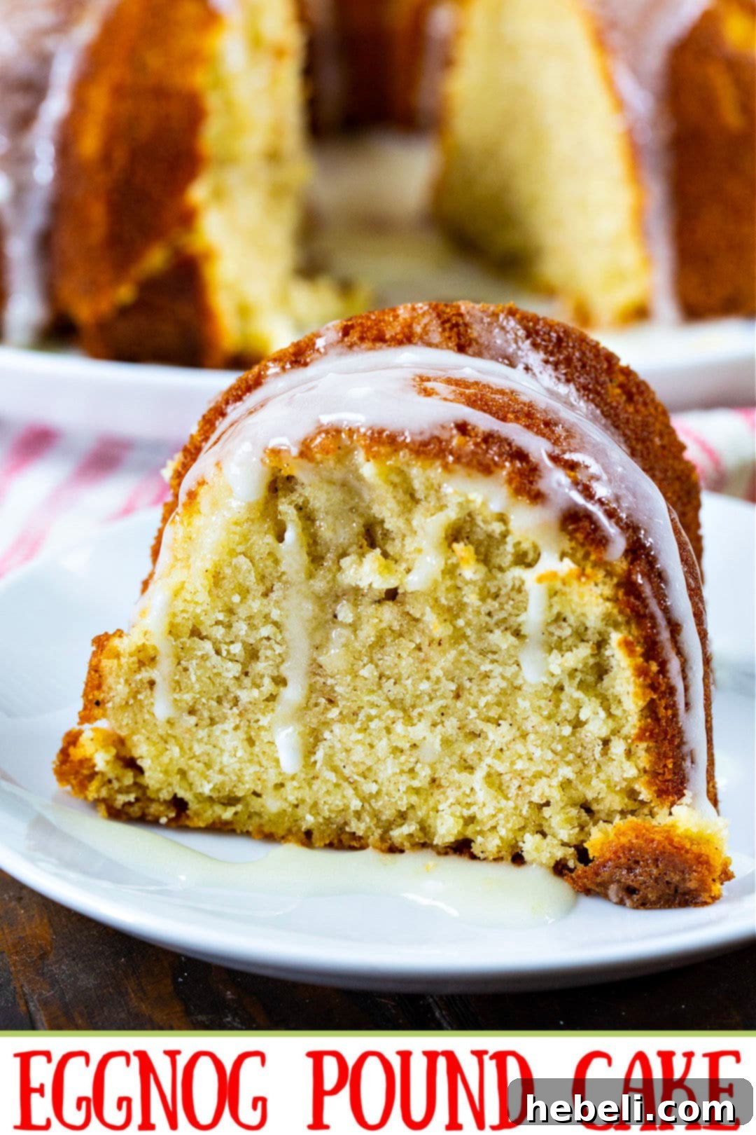 Holiday Eggnog Pound Cake 4 A close-up of a perfectly baked slice of Eggnog Pound Cake, with the creamy glaze elegantly drizzling down its sides, highlighting its perfect texture and festive appeal.