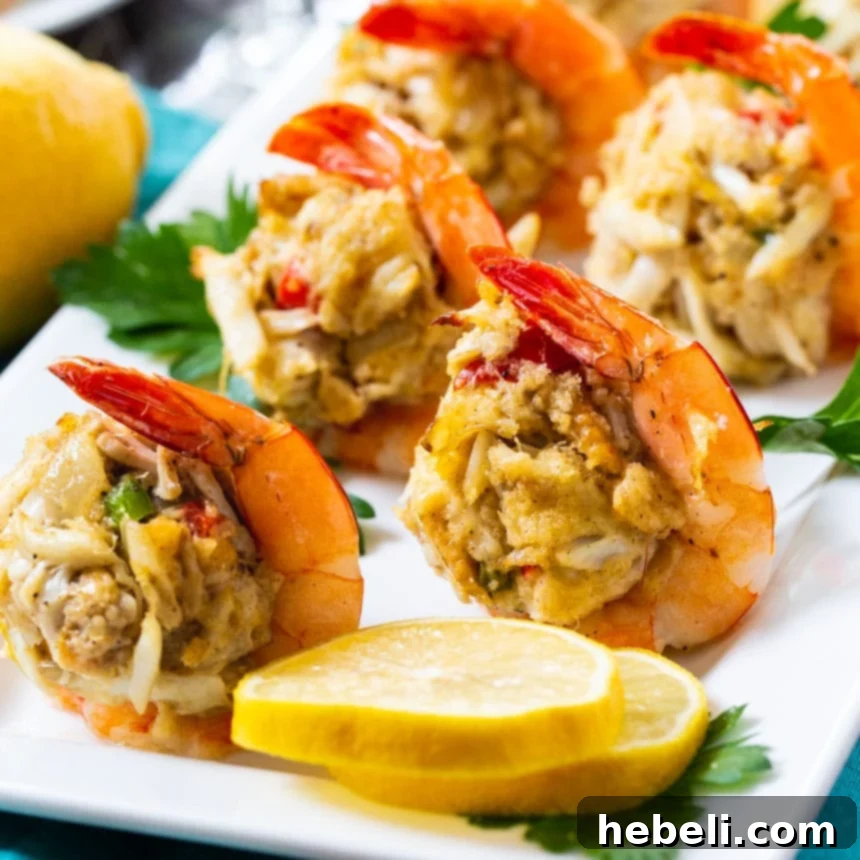 Elegant Crab Cake Stuffed Shrimp, perfectly golden and garnished on a serving platter.