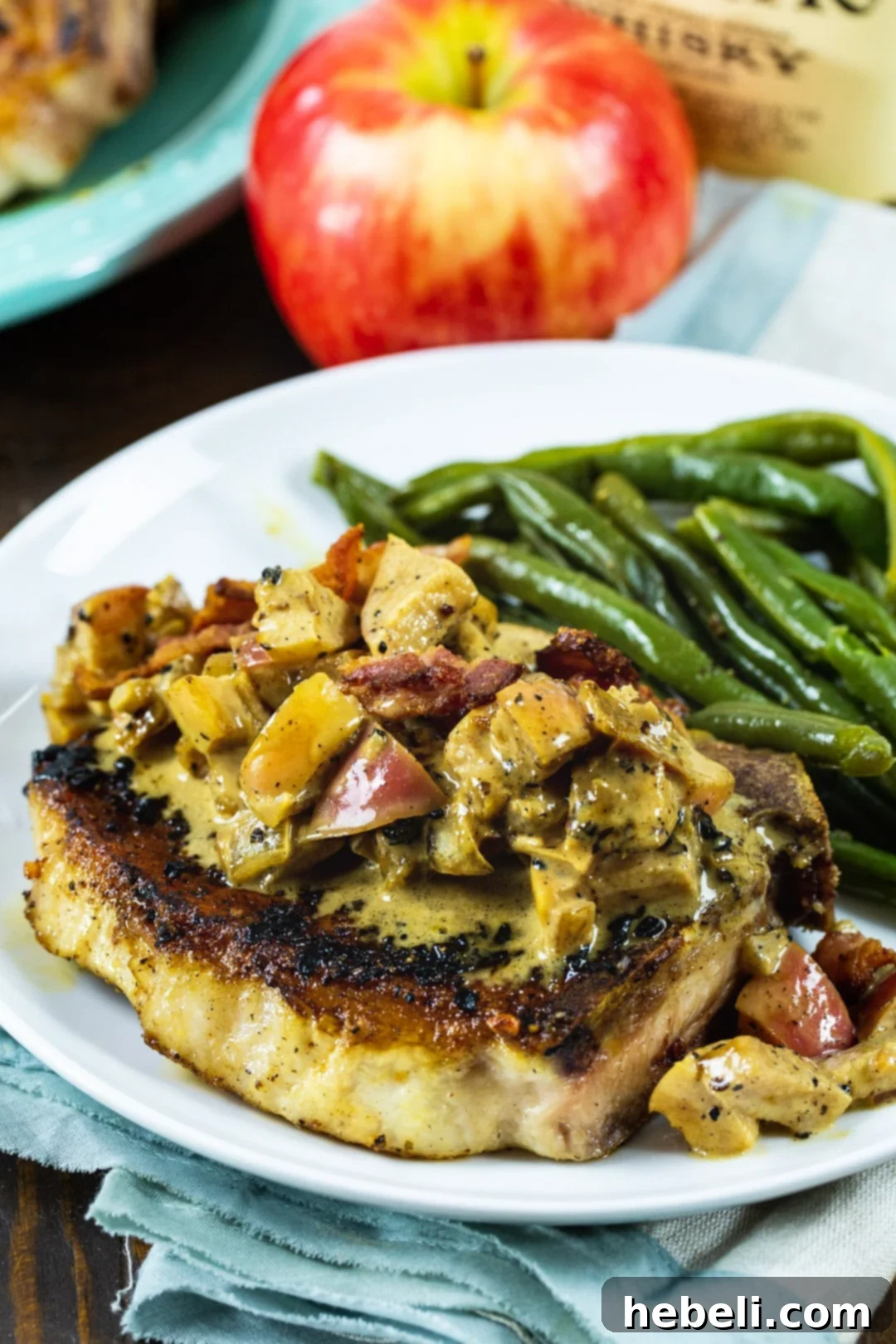 Close-up of cooked pork chop on a plate.
