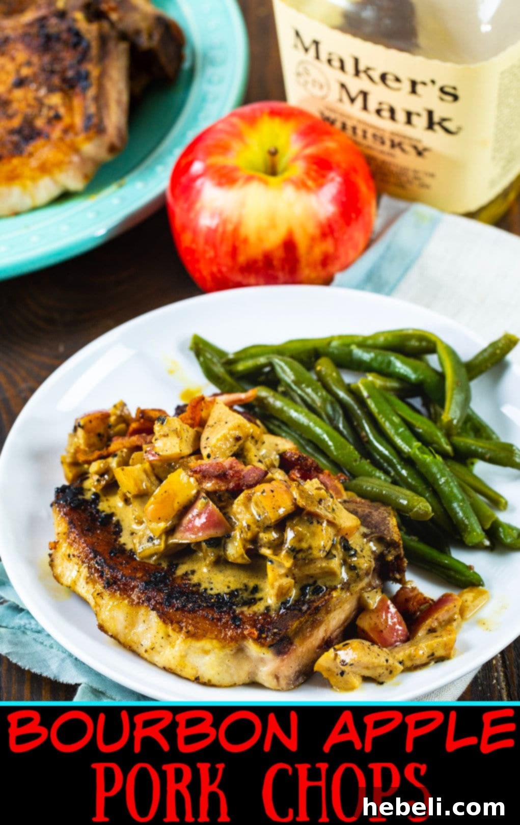 Bourbon Apple Pork Chop on plate with green beans.