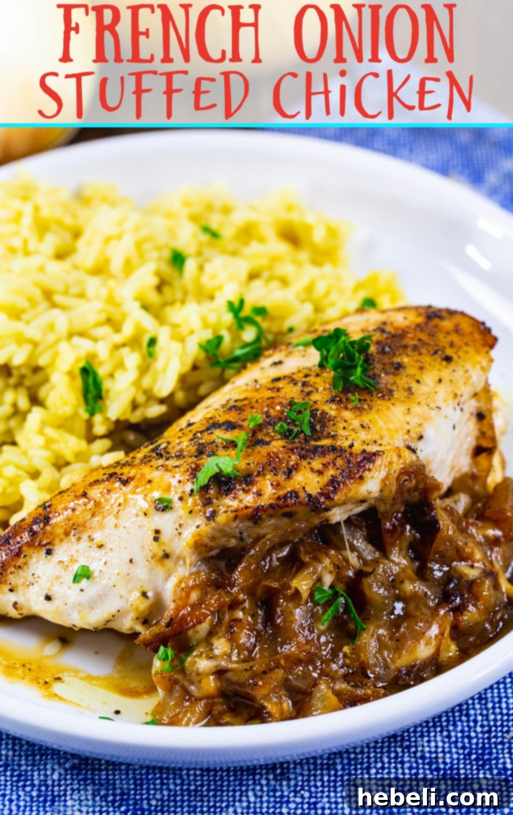 French Onion Stuffed Chicken breast on plate with rice.