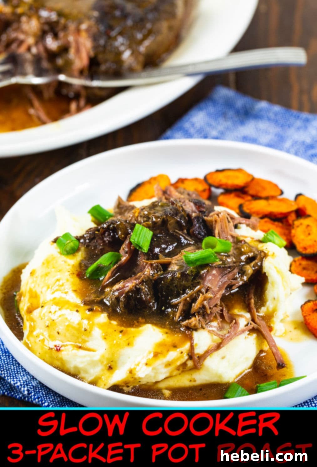 3-Packet Slow Cooker Pot Roast 5 A close-up of Slow Cooker 3-Packet Pot Roast served elegantly over mashed potatoes, showcasing its tenderness and rich gravy.