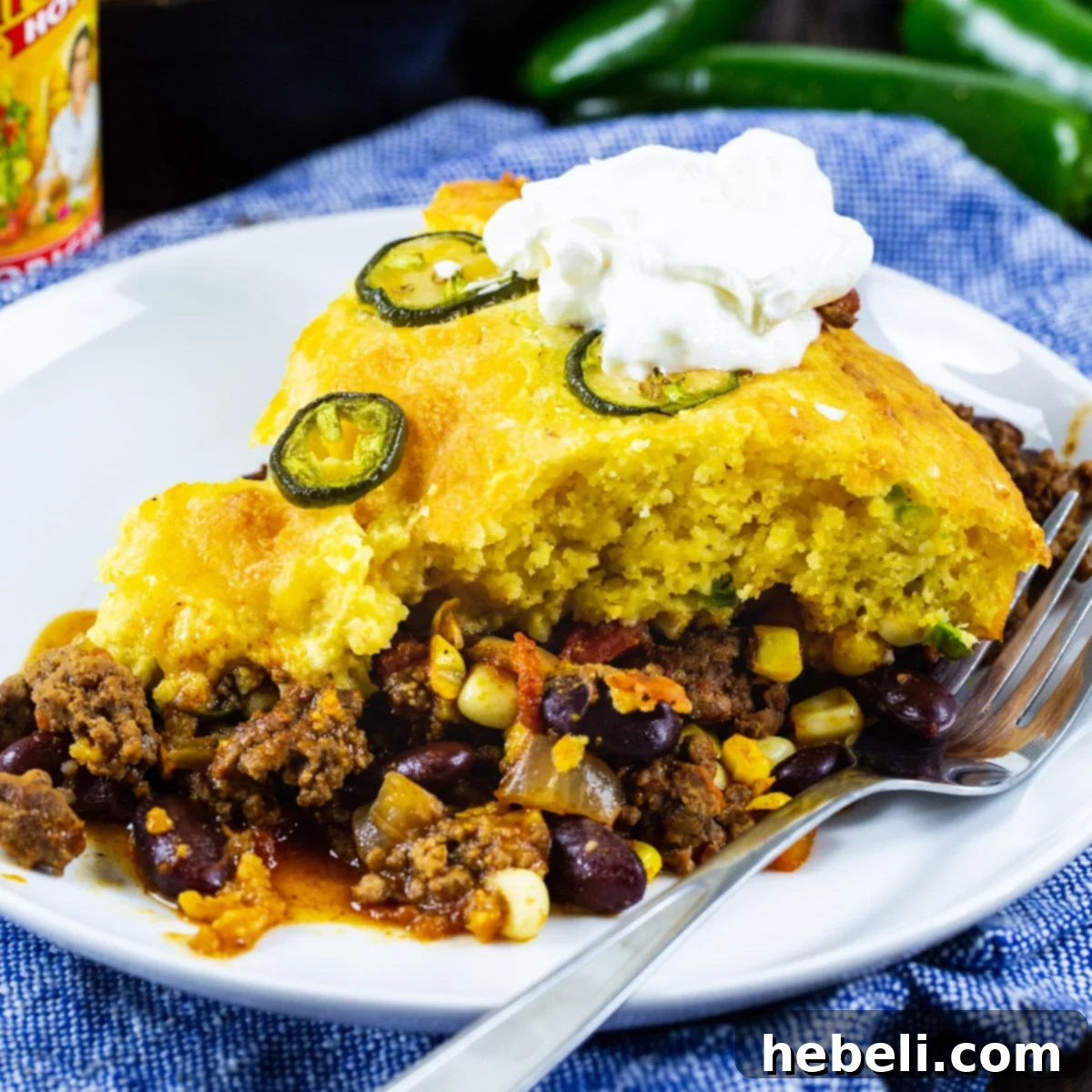 A generous slice of Jalapeno Chili Cornbread Casserole served on a plate, showcasing its layers and texture.