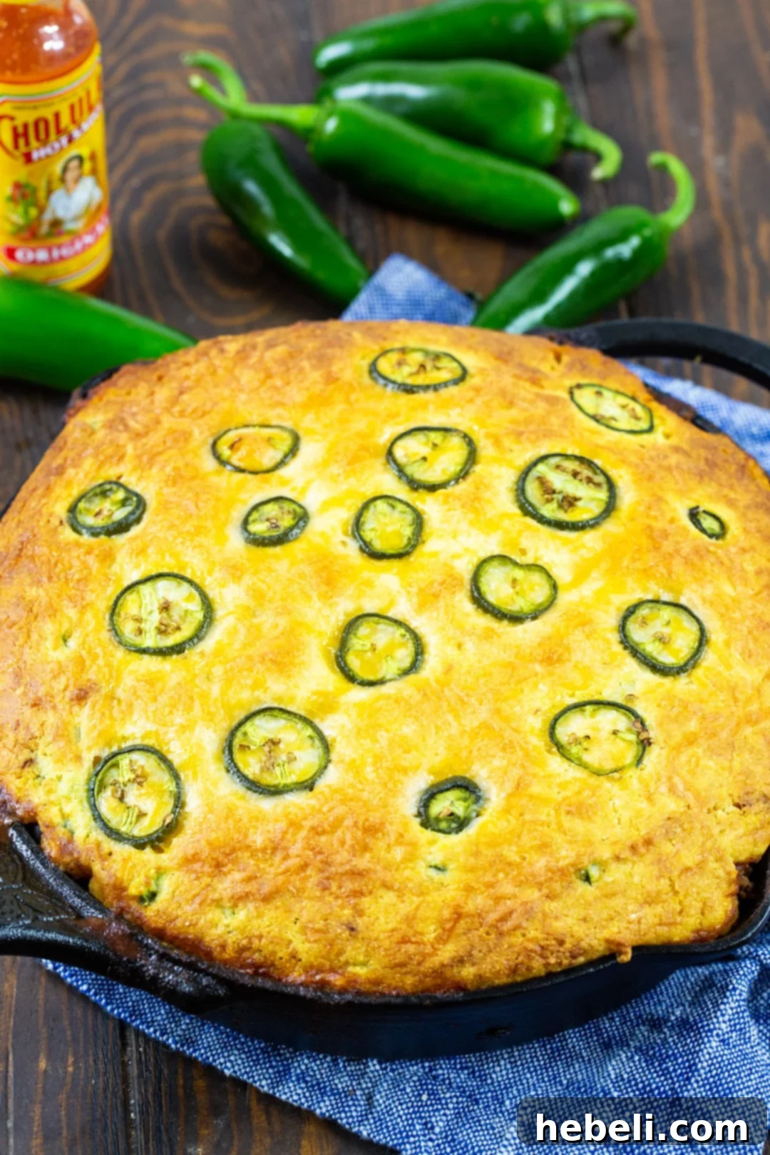 Jalapeno Chili Cornbread Casserole freshly baked in a cast iron pan, ready to be served.