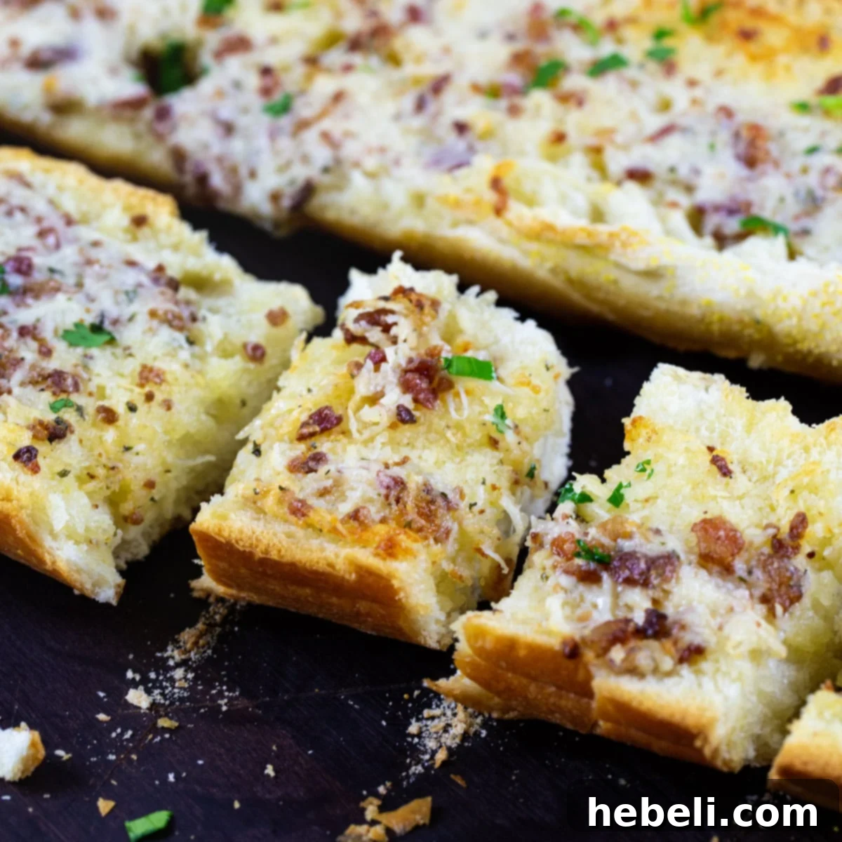 Slices of golden-brown Ranch Garlic Bread, perfectly toasted and ready to serve.