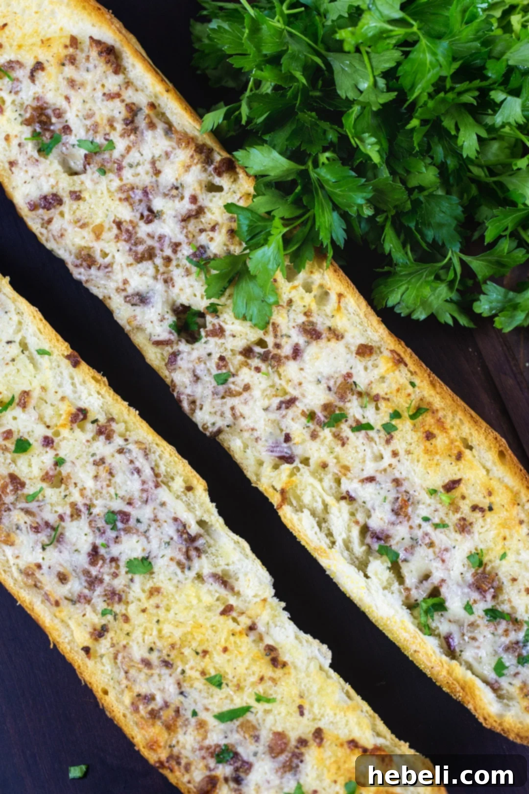 Two generous pieces of Ranch Garlic Bread, showcasing the spread and crispiness.