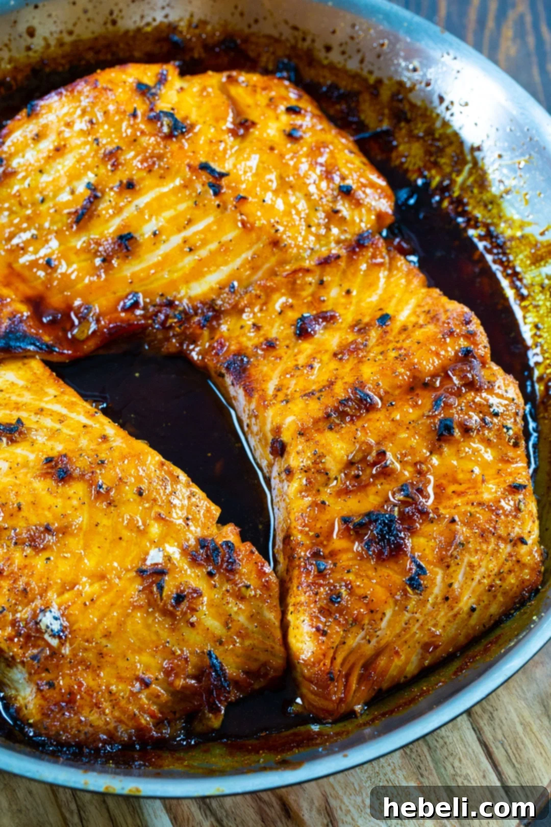 Perfect Honey Garlic Salmon 3 Three salmon fillets in skillet.