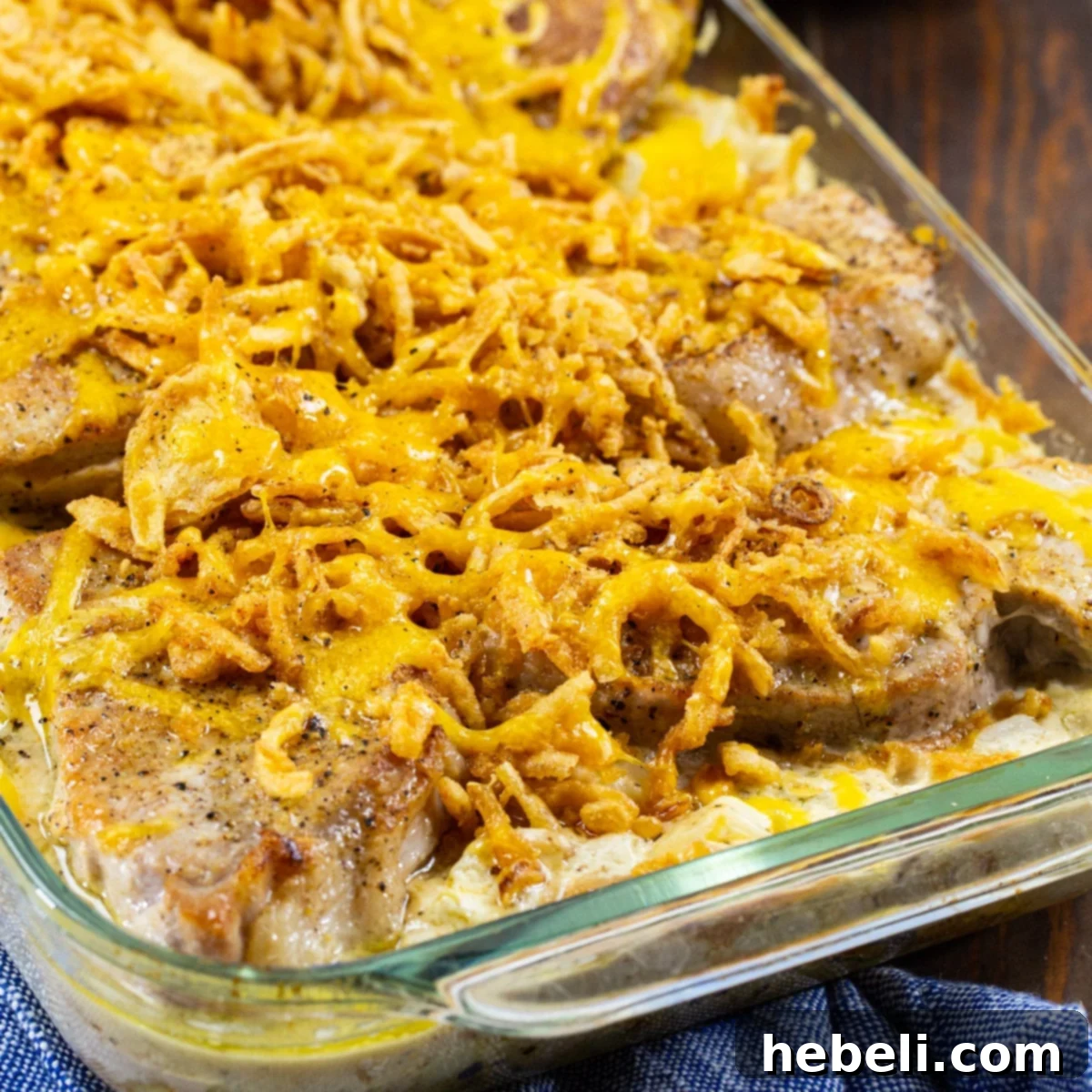 Large 9x13 inch baking dish filled with golden brown Pork Chop Potato Casserole, ready to serve.