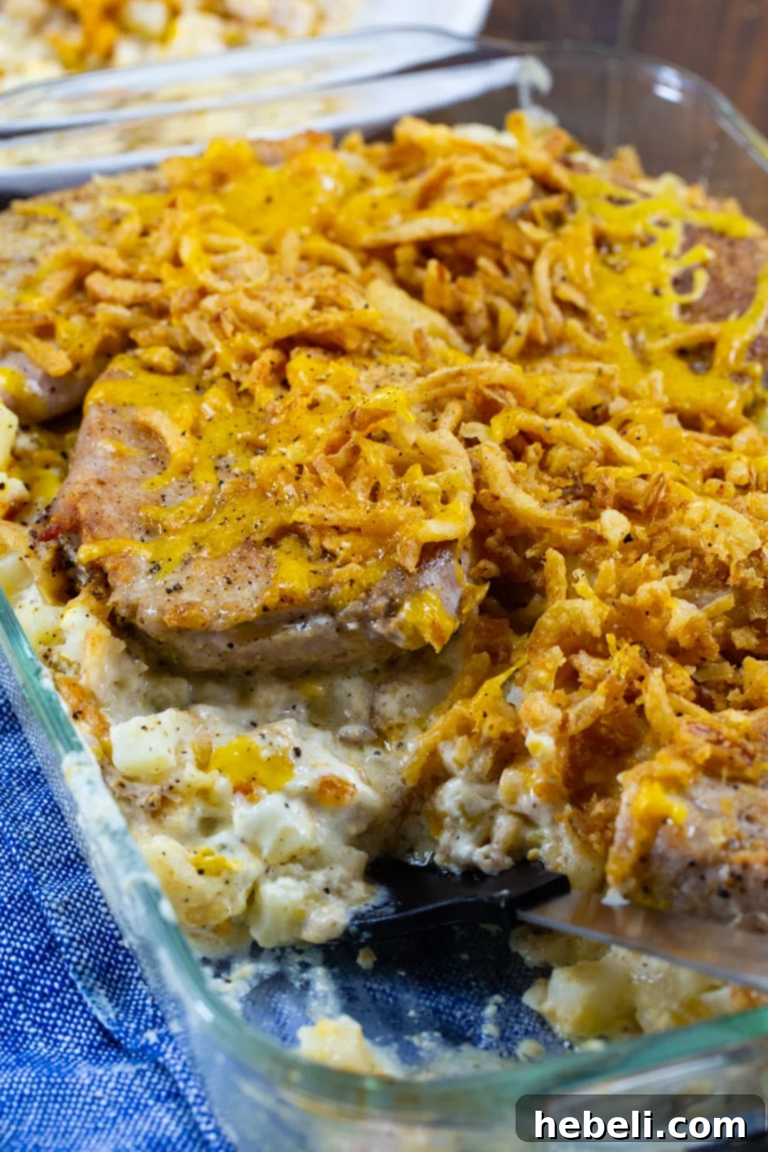 Pork Chop Potato Casserole in a large 9x13-inch baking dish before being placed in the oven.