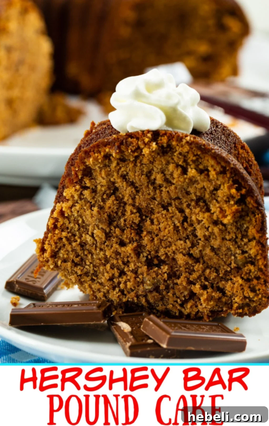 A beautifully presented, golden-brown Hershey Bar Pound Cake, still warm from the oven, resting on a wire rack on a serving platter. The classic Bundt shape is perfectly defined, promising a delicious dessert.