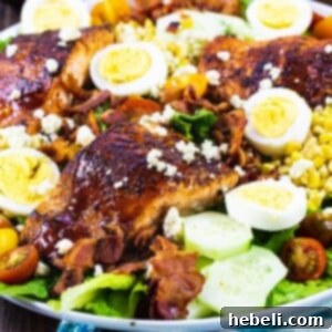 Delicious BBQ Salmon Cobb Salad beautifully arranged on a plate