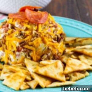 Loaded Pepperoni Cheese Ball 5 Close-up of a Pepperoni Cheese Ball, garnished and ready to serve.