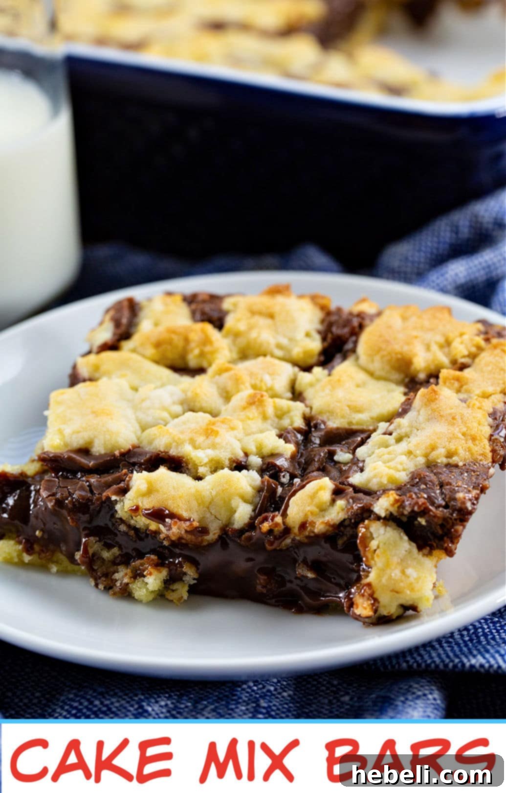 A close-up of a stack of Cake Mix Bars, showing the gooey chocolate center.