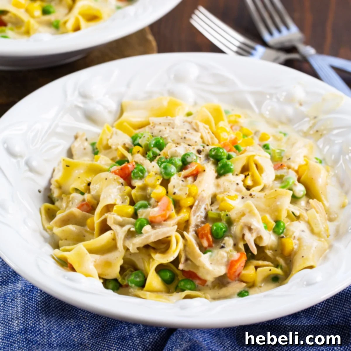 Pot Pie Noodle Casserole 2 A comforting bowl of Chicken Pot Pie Noodles, showcasing the creamy sauce and tender ingredients.