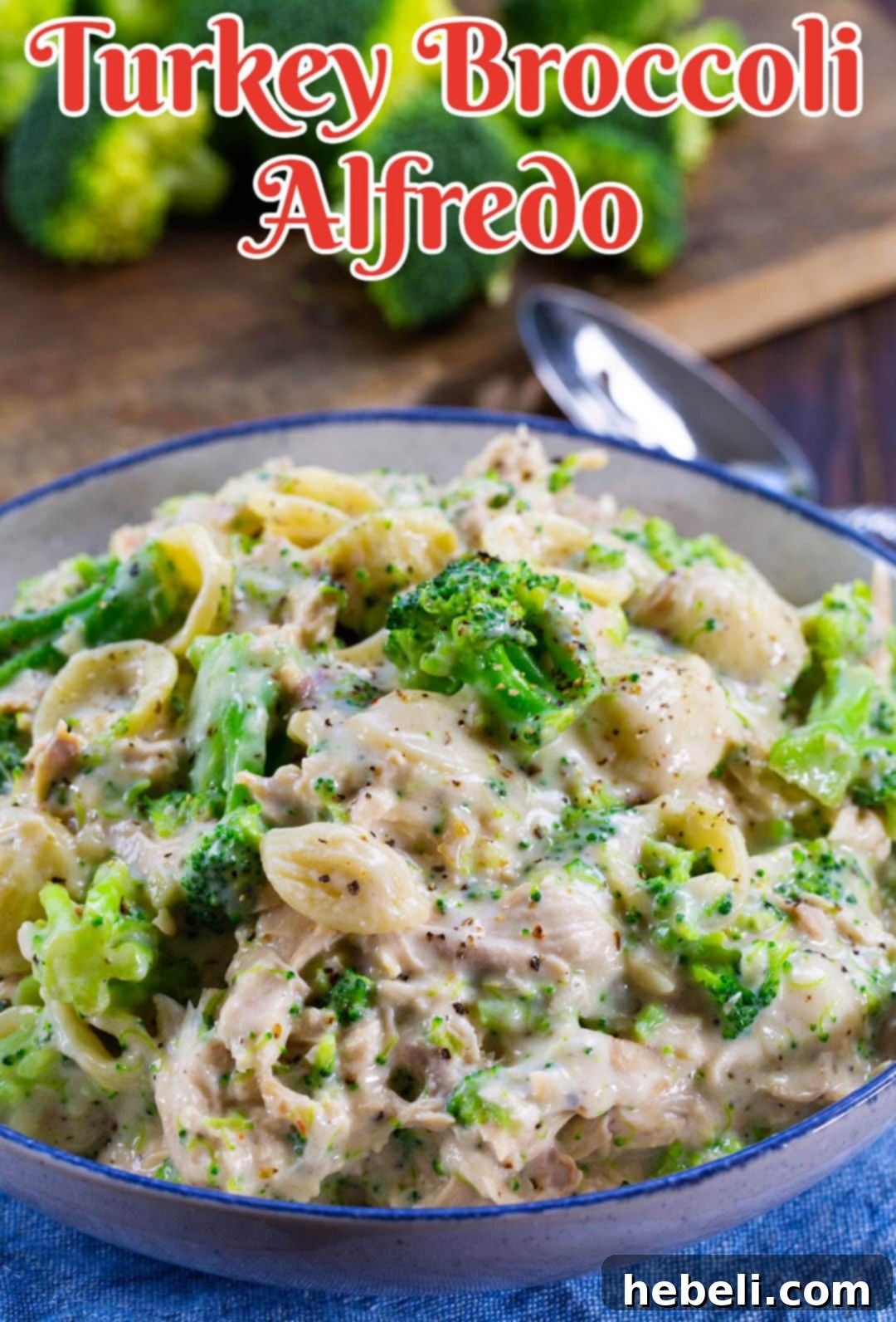 Hearty Turkey Broccoli Alfredo 4 A large serving bowl filled with Turkey Broccoli Alfredo, garnished and ready to be shared.