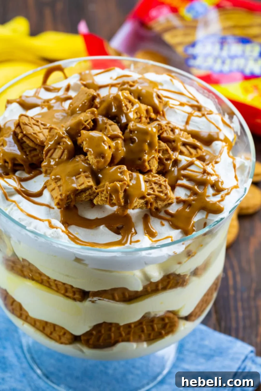 Nutter Butter Banana Pudding 3 Close-up shot of Nutter Butter Banana Pudding layers in a trifle dish, highlighting the creamy texture and cookie pieces.