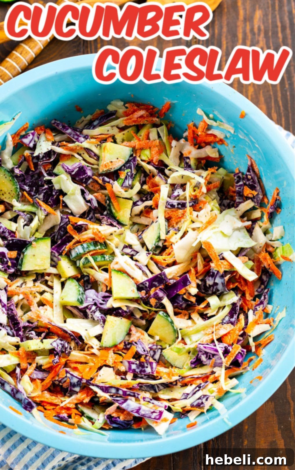 Large bowl of coleslaw with cucumbers, ready to serve.
