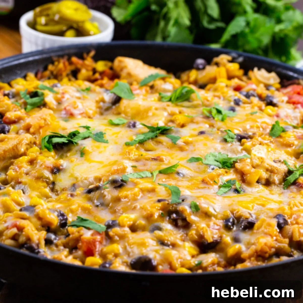 A vibrant Mexican Chicken and Rice Casserole simmering in a large skillet, ready to serve.