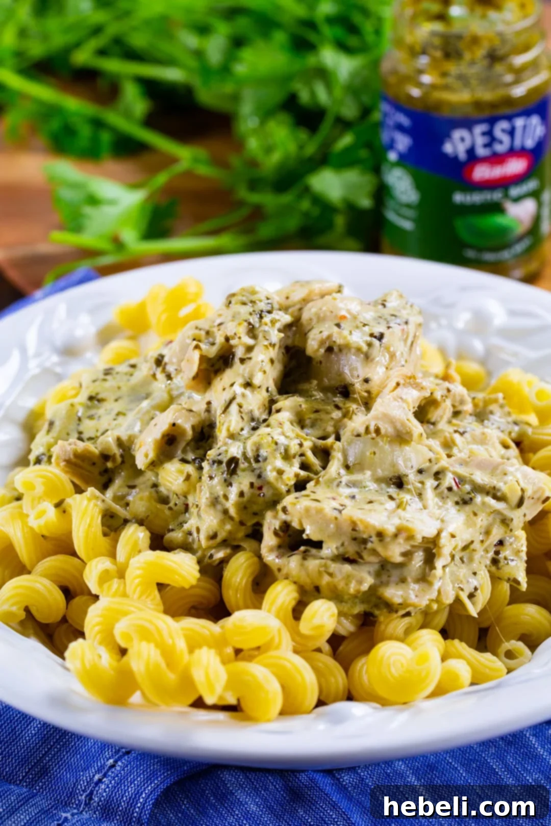 Creamy Pesto Chicken served over pasta.