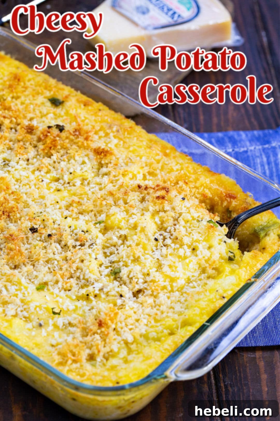 Creamy Cheesy Potato Bake 3 A close-up view of Cheesy Mashed Potato Casserole in a white dish, showing the creamy texture and melted cheese.