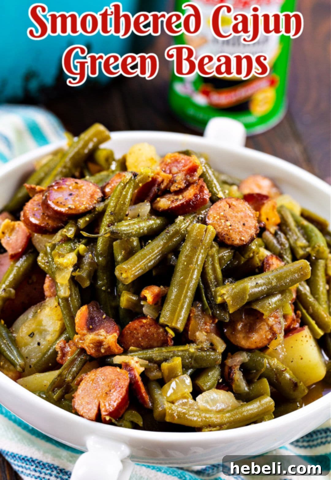 A large serving of Smothered Cajun Green Beans with a focus on the rich sauce and tender ingredients.